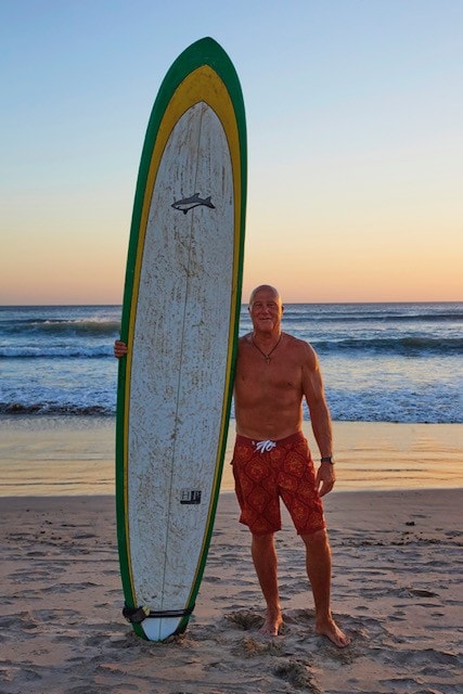 Kevin Walker with his surfboard